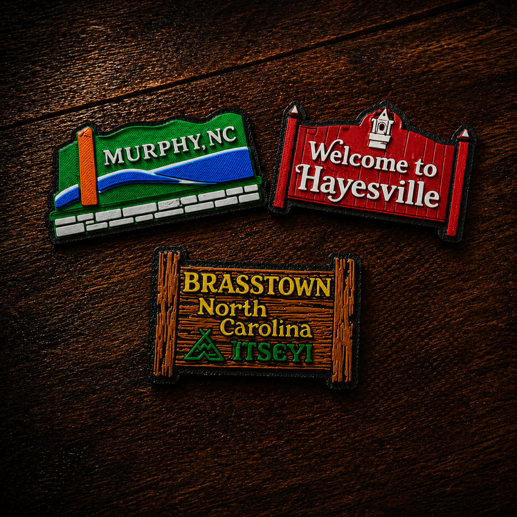 Custom-designed magnets, signs, and souvenirs inspired by local towns and mountain culture.