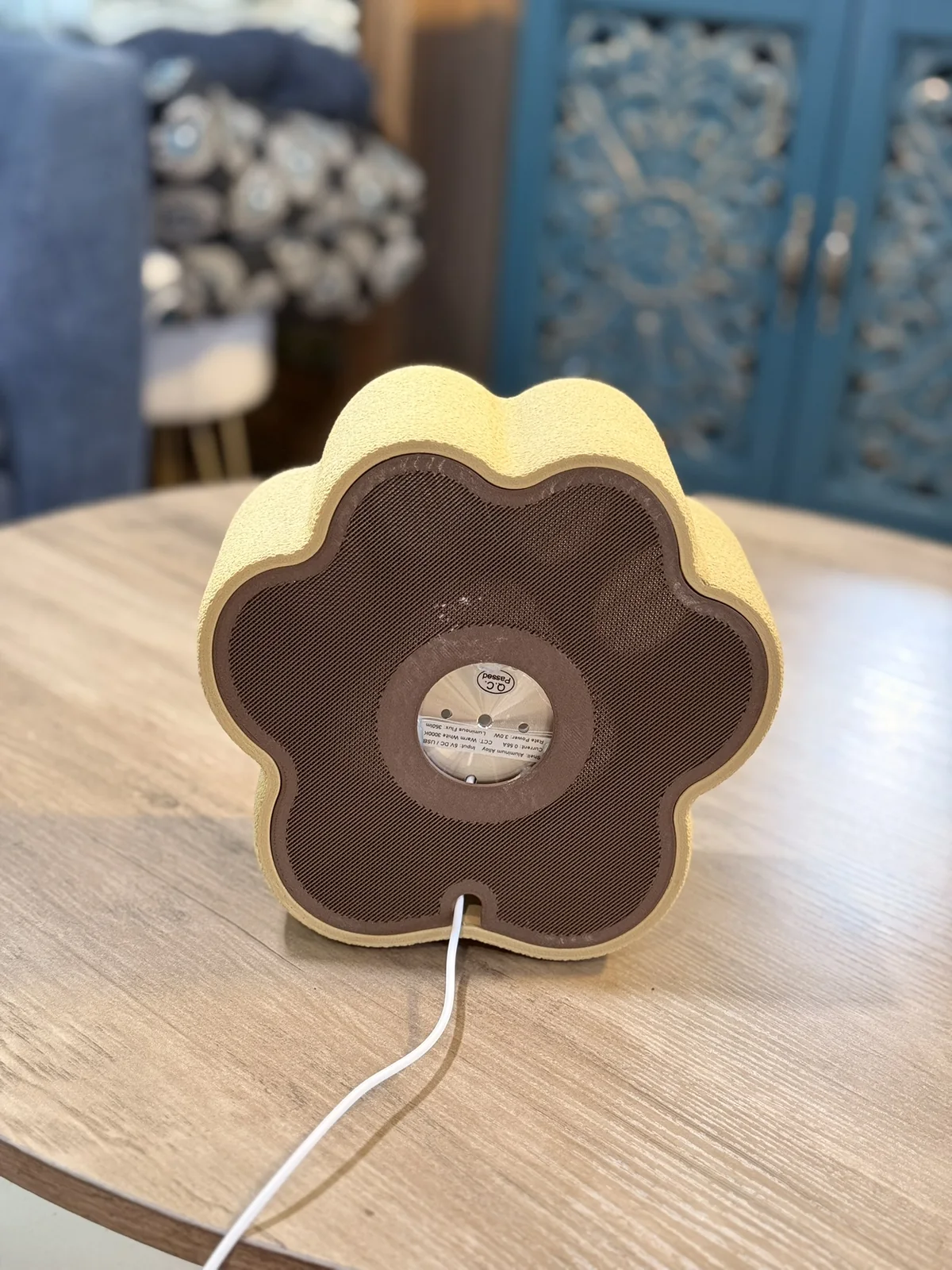 Anonymous custom print job example showing the back and cord opening of a 3D printed paw-shaped lamp.