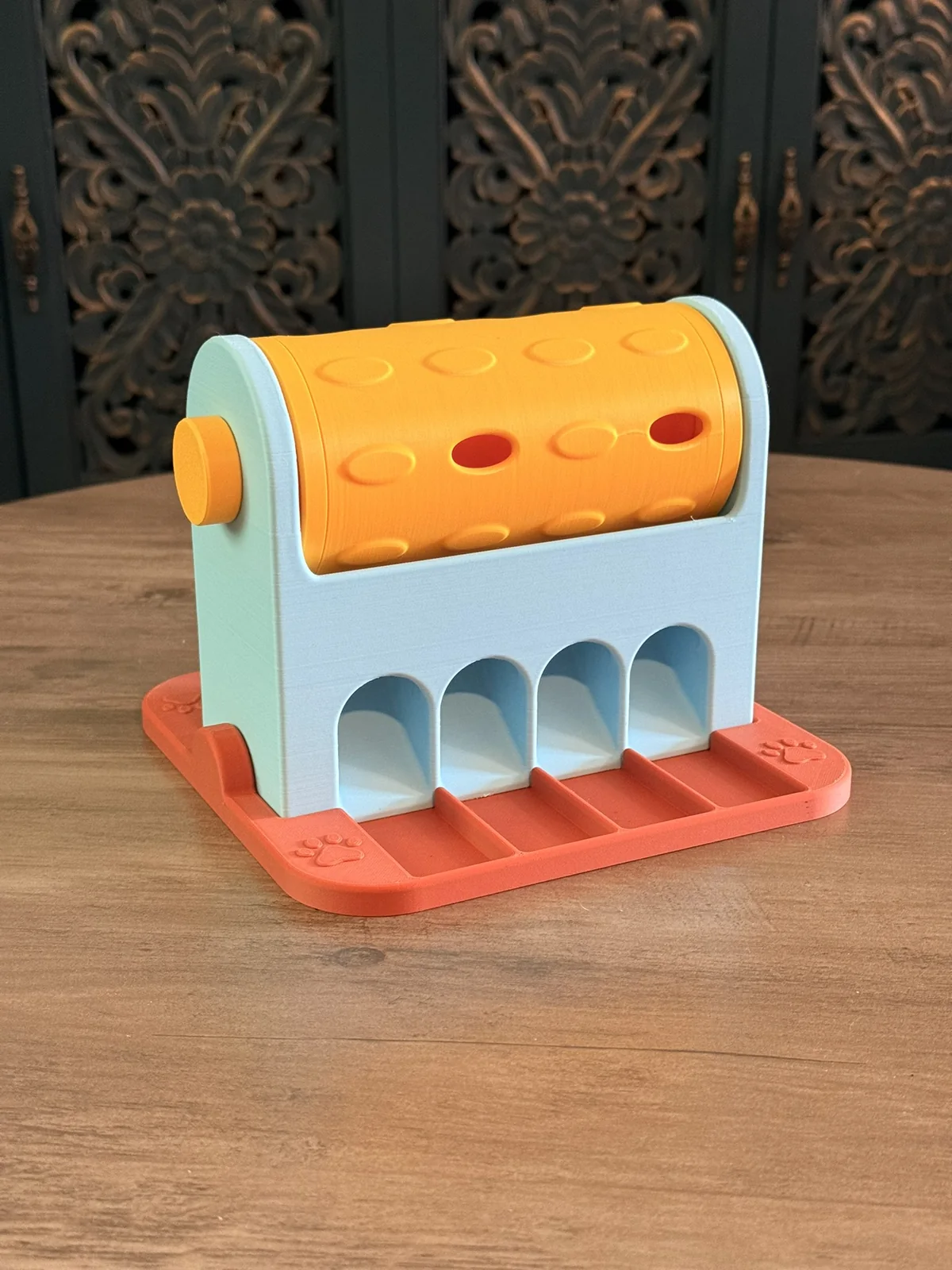 Anonymous custom print job example showing an angled view of a 3D printed spinning treat roller.