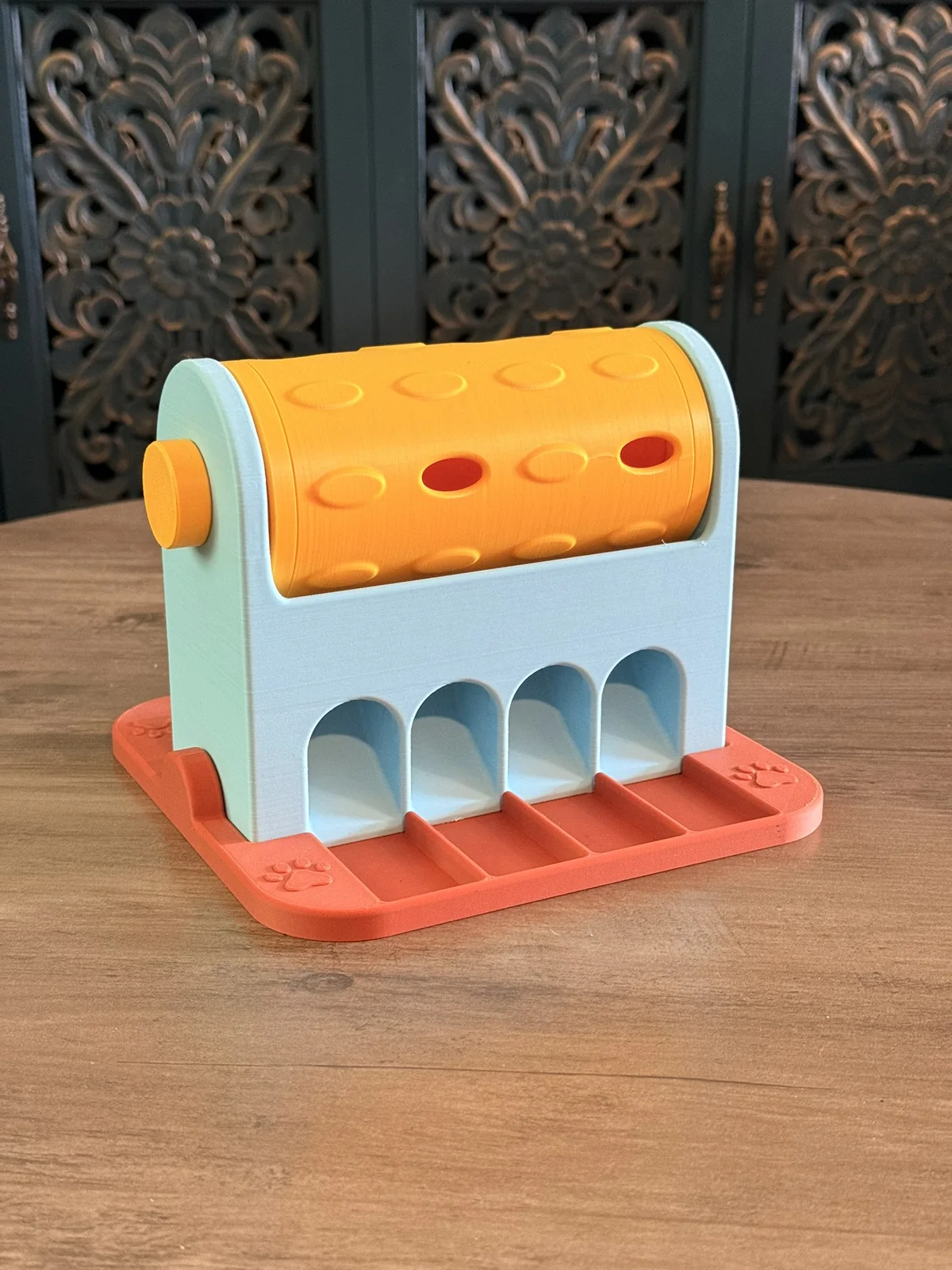 Anonymous custom print job example showing a close view of a 3D printed spinning treat roller.