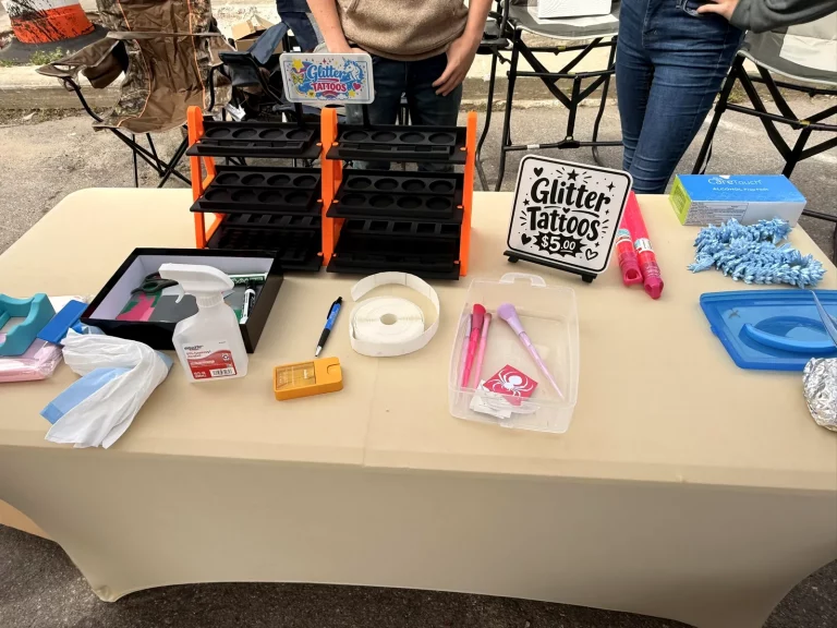Faerie Dust and Treasure Company glitter tattoo setup at Murphy Spring Festival 2026.