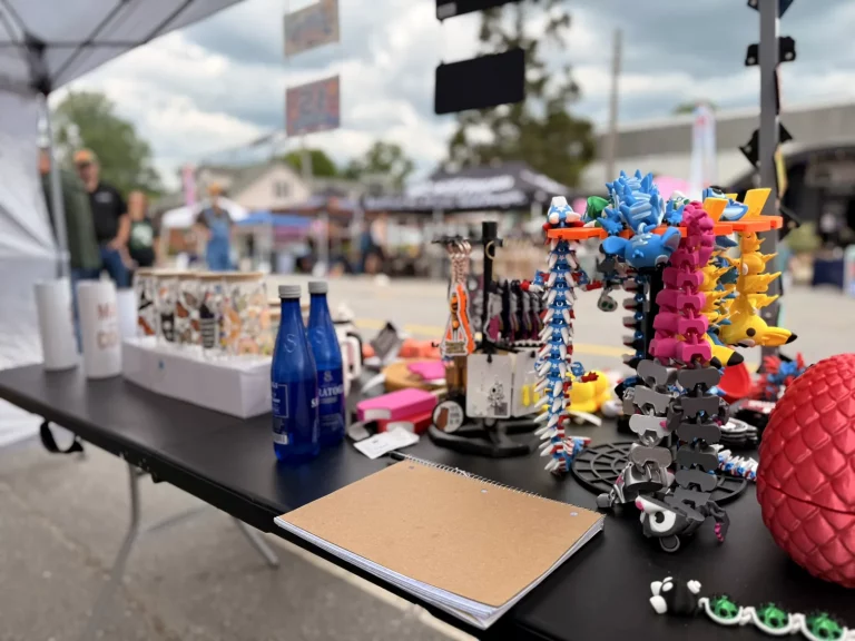 Close-up of PixelMaistir 3D printed products on display at Murphy Spring Festival 2026.