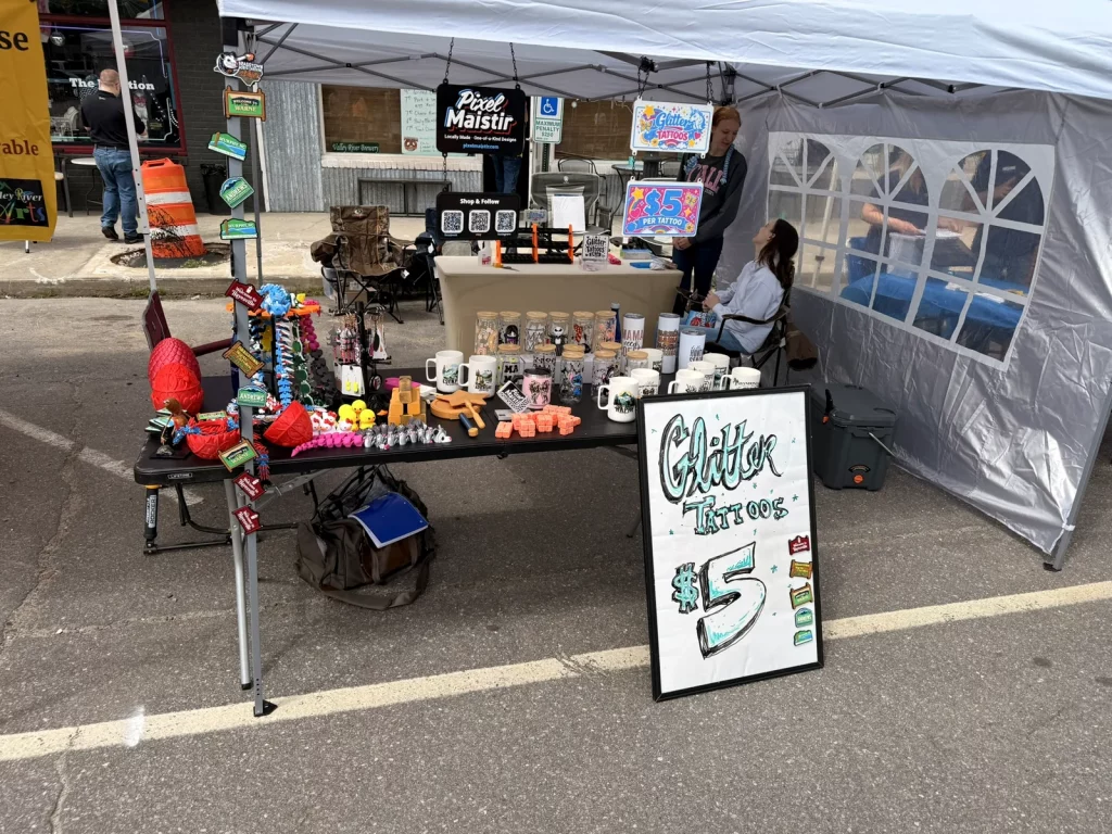 Front view of the PixelMaistir vendor booth at Murphy Spring Festival 2026.